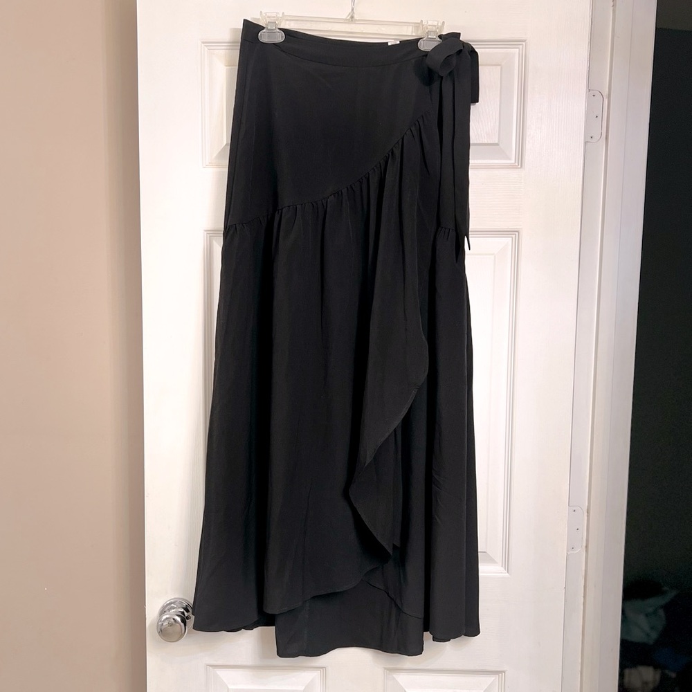 Comfortable flow wrap skirt with attached belt to tie into bow.